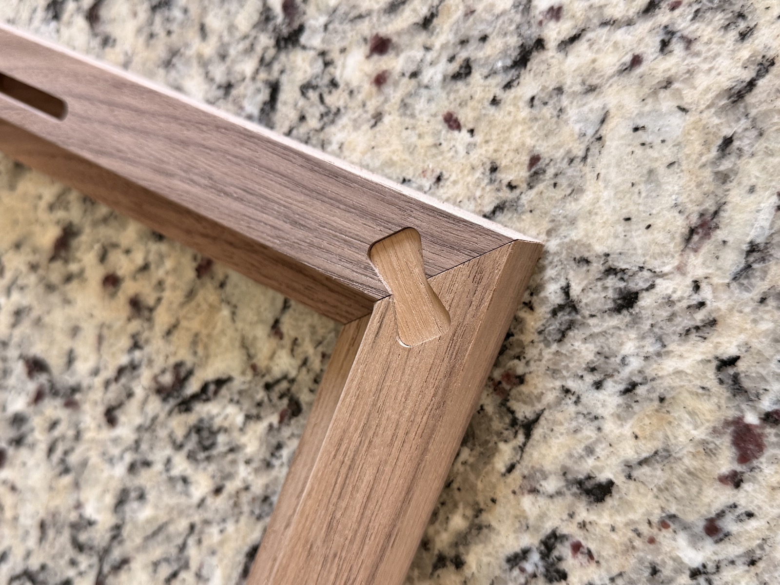 Walnut picture frame with reinforced bowtie joinery